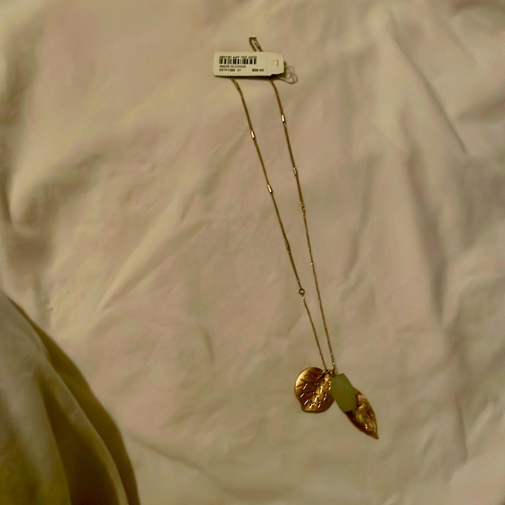 Gold necklace with multiple pendants